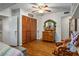 Cozy bedroom with wood floors, ceiling fan, closet with bi-fold doors, and vanity at 1115 Melville Dr, Las Vegas, NV 89102