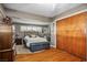 Comfortable bedroom with wood floors, and a bench at the foot of the bed at 1115 Melville Dr, Las Vegas, NV 89102