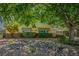 Quaint single-story home with desert landscaping and mature shade trees at 1115 Melville Dr, Las Vegas, NV 89102