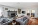 Inviting living room with a cozy fireplace, comfortable sofas, and plenty of natural light at 1115 Melville Dr, Las Vegas, NV 89102