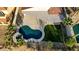 Aerial view of the property showcasing the pool, patio, landscaping, and modern architecture at 1223 Casa Palermo Circle Cir, Henderson, NV 89011
