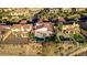 An elevated view of a home featuring a covered patio, private pool, and well-maintained landscaping at 1223 Casa Palermo Circle Cir, Henderson, NV 89011