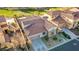 An aerial view of a home with a red tile roof, desert landscaping, and a two-car garage at 1223 Casa Palermo Circle Cir, Henderson, NV 89011