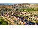 Expansive aerial view of a vibrant community nestled among rolling hills and lush green spaces at 1223 Casa Palermo Circle Cir, Henderson, NV 89011