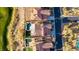 Aerial shot of property showcasing a pool, landscaping, and proximity to a neighborhood street at 1223 Casa Palermo Circle Cir, Henderson, NV 89011