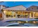 Relaxing backyard space with a pool, covered patio, and well-maintained landscaping at 1223 Casa Palermo Circle Cir, Henderson, NV 89011