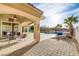 Backyard patio area showcasing a beautiful pool, spa, and mature landscaping at 1223 Casa Palermo Circle Cir, Henderson, NV 89011