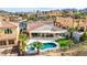 Aerial view of a backyard with a pool, covered patio, and desert landscaping at 1223 Casa Palermo Circle Cir, Henderson, NV 89011
