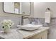 Close up bathroom with a stylish marble countertop and vessel sink, complemented by modern fixtures and decor at 1223 Casa Palermo Circle Cir, Henderson, NV 89011