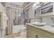 Beautiful bathroom featuring marble countertops, modern lighting, and tub with decorative tile and stylish vessel sink at 1223 Casa Palermo Circle Cir, Henderson, NV 89011
