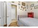 Cozy bedroom with wood floors, closet doors, and a wrought iron bed, offering a comfortable retreat at 1223 Casa Palermo Circle Cir, Henderson, NV 89011