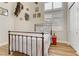 Charming bedroom with a wrought iron bed, wood floors, shuttered windows, and high ceilings at 1223 Casa Palermo Circle Cir, Henderson, NV 89011