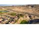 Stunning aerial view capturing a luxury community with homes nestled within a desert and golf course setting at 1223 Casa Palermo Circle Cir, Henderson, NV 89011