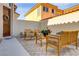 Cozy courtyard with pavers, desert landscaping, and wooden outdoor seating at 1223 Casa Palermo Circle Cir, Henderson, NV 89011