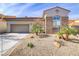 Charming home with stone accents, desert landscaping, and a two-car garage at 1223 Casa Palermo Circle Cir, Henderson, NV 89011