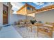 Inviting front courtyard with patio furniture, desert landscaping, and a secured entry gate at 1223 Casa Palermo Circle Cir, Henderson, NV 89011