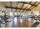 A well-equipped gym space with wooden floors, high ceilings, and various weight training machines at 1223 Casa Palermo Circle Cir, Henderson, NV 89011