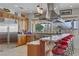 Gourmet kitchen featuring stainless steel appliances, granite countertops, and a breakfast bar at 1223 Casa Palermo Circle Cir, Henderson, NV 89011