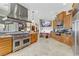 Gourmet kitchen with granite counters, stainless steel appliances, and a view into the living space at 1223 Casa Palermo Circle Cir, Henderson, NV 89011