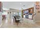 Spacious open-concept living area with pool view, leading to kitchen with counter seating at 1223 Casa Palermo Circle Cir, Henderson, NV 89011