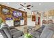 Cozy living room with a striking wood-paneled wall, fireplace, and curated art collection at 1223 Casa Palermo Circle Cir, Henderson, NV 89011