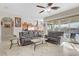 Bright open living room with comfortable seating and seamless indoor-outdoor flow to the pool area at 1223 Casa Palermo Circle Cir, Henderson, NV 89011