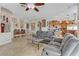 Spacious living room with tile flooring, comfortable seating, and an open layout at 1223 Casa Palermo Circle Cir, Henderson, NV 89011