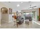 Bright, open living room featuring comfortable seating and access to a stunning outdoor pool area at 1223 Casa Palermo Circle Cir, Henderson, NV 89011