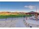 Scenic outdoor seating area with golf course and mountain views, offering a relaxing space for leisure and enjoyment at 1223 Casa Palermo Circle Cir, Henderson, NV 89011