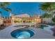 Stunning backyard with a refreshing pool, relaxing hot tub, and well-manicured lawn perfect for outdoor entertaining at 1223 Casa Palermo Circle Cir, Henderson, NV 89011