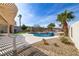 Inviting pool and spa area with desert landscaping and a covered patio at 1223 Casa Palermo Circle Cir, Henderson, NV 89011