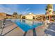 This is a community pool, surrounded by lounge seating, with a nearby clubhouse for gatherings at 1223 Casa Palermo Circle Cir, Henderson, NV 89011