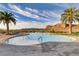 A community pool framed by palm trees and mountains, offers a tranquil spot for residents to unwind at 1223 Casa Palermo Circle Cir, Henderson, NV 89011