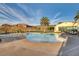A pristine community pool, with poolside loungers and a mountain view, is perfect for relaxation at 1223 Casa Palermo Circle Cir, Henderson, NV 89011