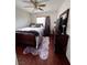 Cozy bedroom featuring wood floors, ceiling fan, a window with blinds, and a beautiful wood bedroom set at 2180 Polynesia Cir, Henderson, NV 89074