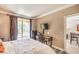 Relaxing bedroom showcasing a balcony, desk, and television for ultimate convenience at 230 E Flamingo Rd # 203, Las Vegas, NV 89169