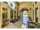 Elegant community entrance with manicured planters and access to clubhouse through glass doors, enhancing curb appeal at 230 E Flamingo Rd # 203, Las Vegas, NV 89169