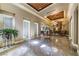 Grand foyer featuring high ceilings, marble floors, chandelier, tapestry, and elegant decor at 230 E Flamingo Rd # 203, Las Vegas, NV 89169