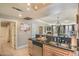 Open concept kitchen with stainless appliances, granite countertops, and convenient access to living spaces at 230 E Flamingo Rd # 203, Las Vegas, NV 89169