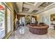 Elegant living room with a fireplace, luxurious seating, coffered ceiling, and marble floors at 230 E Flamingo Rd # 203, Las Vegas, NV 89169