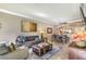 Bright living room featuring stylish decor, a comfortable couch, and an adjacent dining area at 230 E Flamingo Rd # 203, Las Vegas, NV 89169