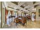 Grand lounge area featuring a baby grand piano, luxurious seating, marble floors, and elegant decor at 230 E Flamingo Rd # 203, Las Vegas, NV 89169