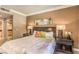 Cozy primary bedroom with an accent wall, stylish lamps, and easy access to the ensuite at 230 E Flamingo Rd # 203, Las Vegas, NV 89169