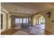 Inviting recreational area features a table tennis and ample natural light streaming through the arched openings at 230 E Flamingo Rd # 203, Las Vegas, NV 89169