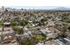 Residential neighborhood featuring mature trees and landscaping, homes, and swimming pools under a blue sky at 2400 Llewellyn Dr, Las Vegas, NV 89102