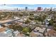 Scenic aerial view of homes and mature trees in a residential area with the Las Vegas skyline in the distance at 2400 Llewellyn Dr, Las Vegas, NV 89102