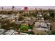 Aerial view of neighborhood with mature trees and the Las Vegas city skyline in the distance at 2400 Llewellyn Dr, Las Vegas, NV 89102