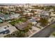 Residential area with lush landscaping, mature trees, and city skyline in the background at 2400 Llewellyn Dr, Las Vegas, NV 89102
