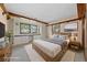 Staged bedroom features beautiful built-in shelving, large windows, and hardwood accents at 2400 Llewellyn Dr, Las Vegas, NV 89102