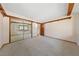 Large room with wall to wall carpeting, decorative wood trim and large mirrored closet at 2400 Llewellyn Dr, Las Vegas, NV 89102